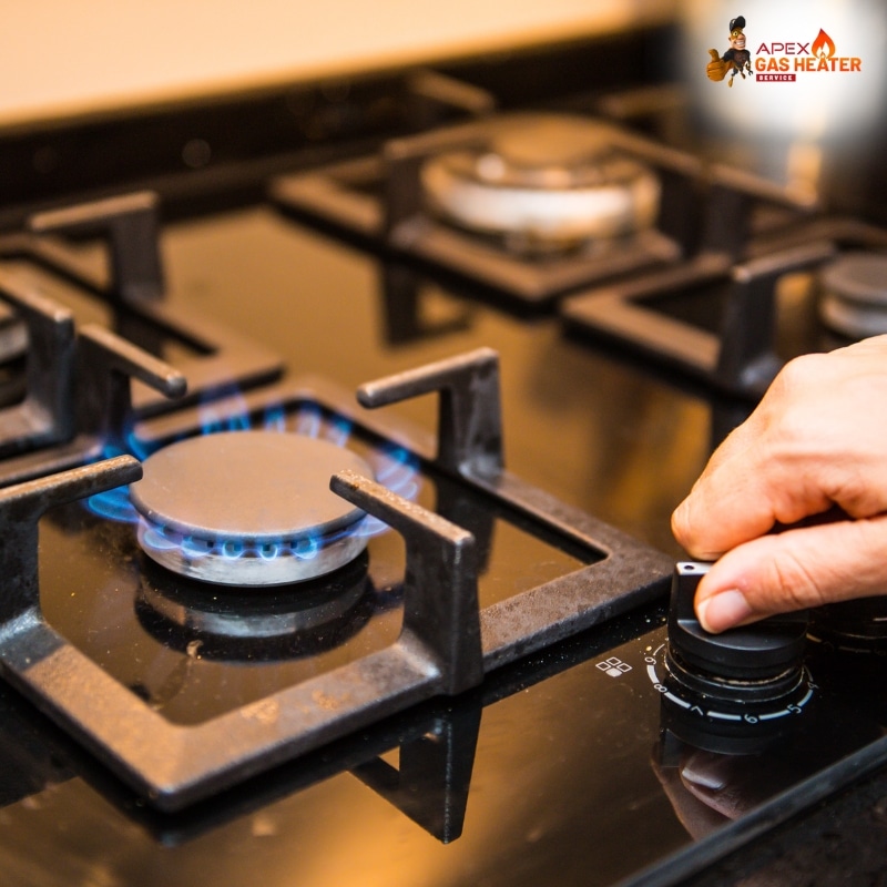 Technician adjusting a burner flame on a gas stove during Gas Stove Service and Repair for efficient performance